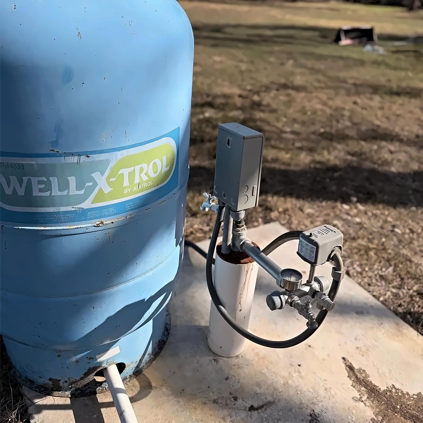 Close view of the well pressure tank and pressure switch
